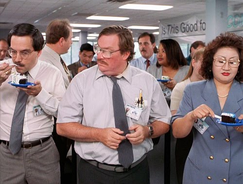Milton from 'Office Space' does not receive any cake during the a birthday celebration. He looks on, forlornly, while everyone else in the office enjoys cake.