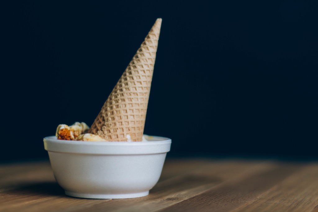 An ice-cream cone in a bowl, turned up at an… erect angle.